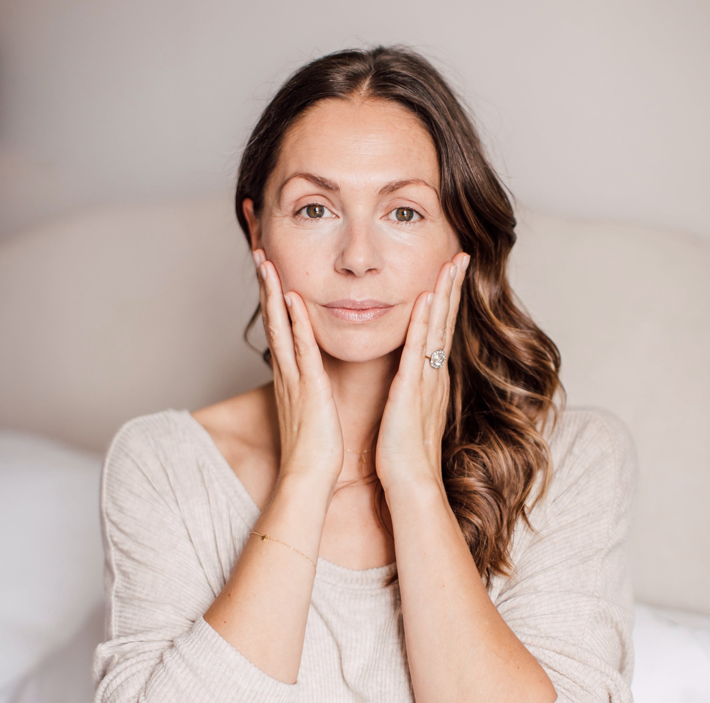 Abigail James, sat in bed, drinking a cacao and collagen