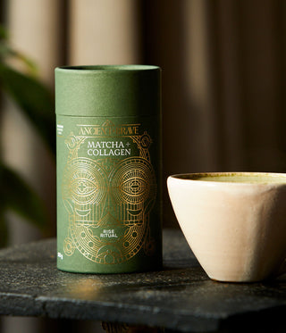 Matcha + Collagen next to a ceramic mug.