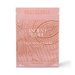 Pink packaging of Ancient Brave True Skin Alchemy with white text on a pink and gold background