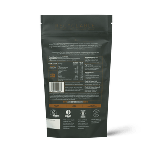 Back view of a dark green package of 'Ancient + Brave True Biome' on a white background