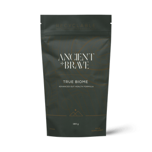 Dark green package of 'Ancient + Brave True Biome' on a white background