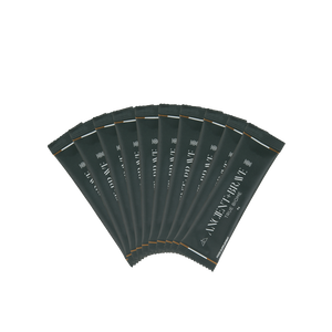 Multiple green sachets of Ancient + Brave's True Biome on a white background