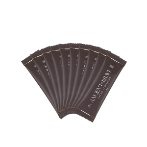 Multiple brown sachets of Ancient + Brave's Cacao + Collagen on a white background
