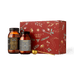 The Ancient + Brave Davina Ritual Gift Set includes two amber glass jars of collagen peptides and creatine, a gold measuring scoop, and a decorative red gift box.