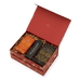 An open red Ancient + Brave Rest Gift Set box containing a restorative sleep tonic, a collagen peptides canister, and a long black box labeled The Ritual Scoop, all nestled in shredded paper.