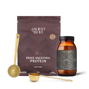 Brave Ancestral Protein and True Creatine with measuring scoops on a white background