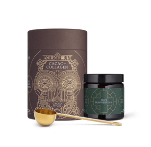 The Ancient + Brave Wind Down Duo—a cylindrical container labeled Cacao + Collagen and a jar labeled True Magnesium+, accompanied by a gold-colored spoon—are artfully arranged against a white background, creating an inviting scene that suggests restorative rest.