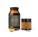 Two brown containers from Ancient + Brave’s Longevity Bundle, featuring gold and black labels, are displayed with a gold measuring scoop on a white background—expertly formulated to support gut health and provide essential fatty acids for long-term wellbeing.