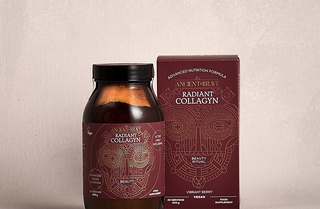 A brown glass jar and a matching maroon box labeled Ancient+Brave Radiant Collagyn with a line-art face design, displayed on a neutral background. The product is for advanced nutrition and is vibrantly berry flavored.