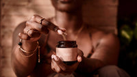 Person holding a jar with a blurred background