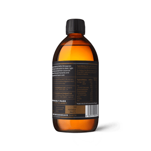 ANCIENT + BRAVE amber glass bottle containing their True MCT Oil made from ethically sourced coconut oil showing the back label of the bottle
